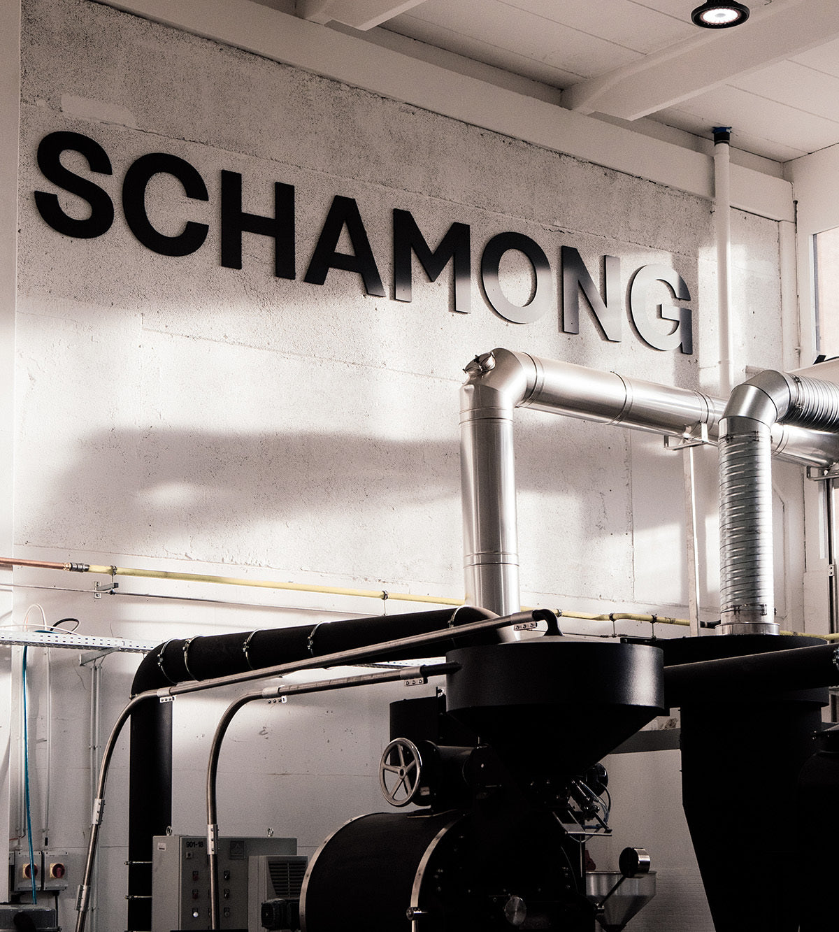 Der Trommelröster in der Schamong Factory unter dem Schriftzug SCHAMONG